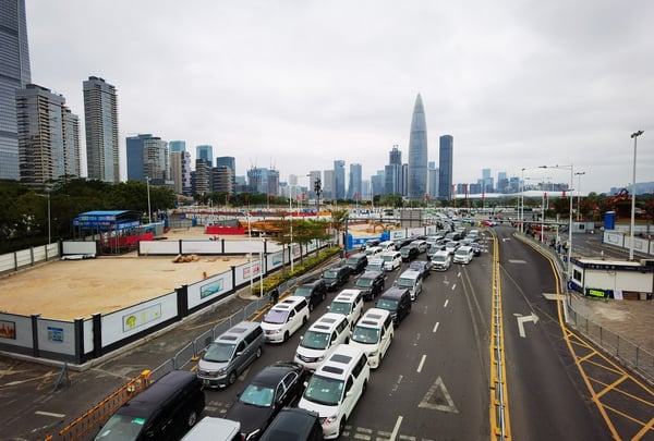 Traffic in Shenzhen Bay as people get their temperature checked for Coronavirus